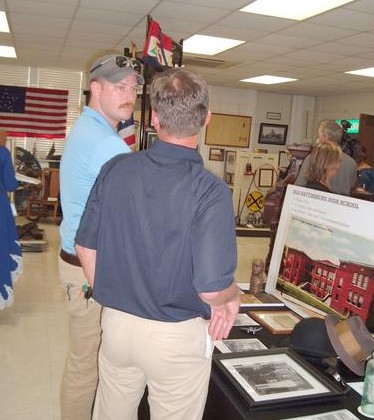 Visitors examine the Hattiesburg High display