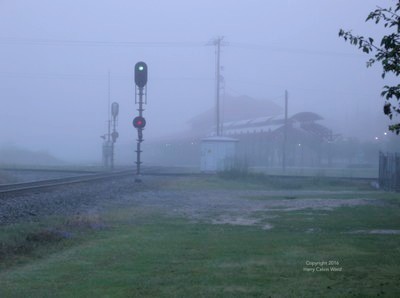 A scene near the railroad on a foggy morning