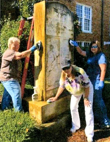Volunteers clean monument