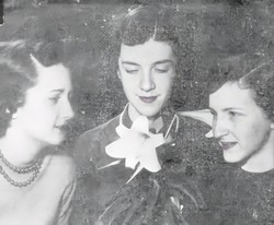 Girls holding an imitation Easter lily