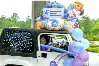 A participant holds a baby goat