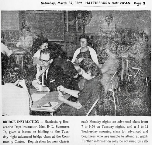 Adults at card tables playing bridge