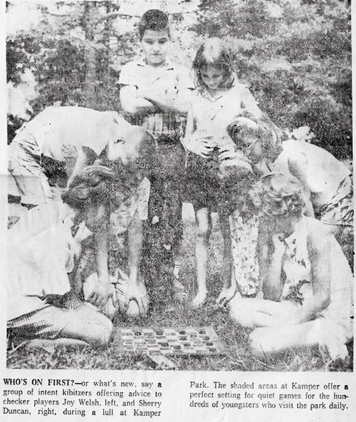 Children play a game of checkers
