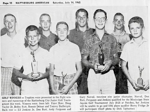Golf winners display their trophies