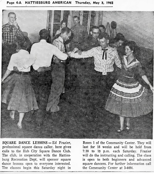 Adults in a square dance lesson